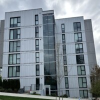 Exterior metal siding project on a modern apartment building Modern commercial buildings exterior finish with metal siding